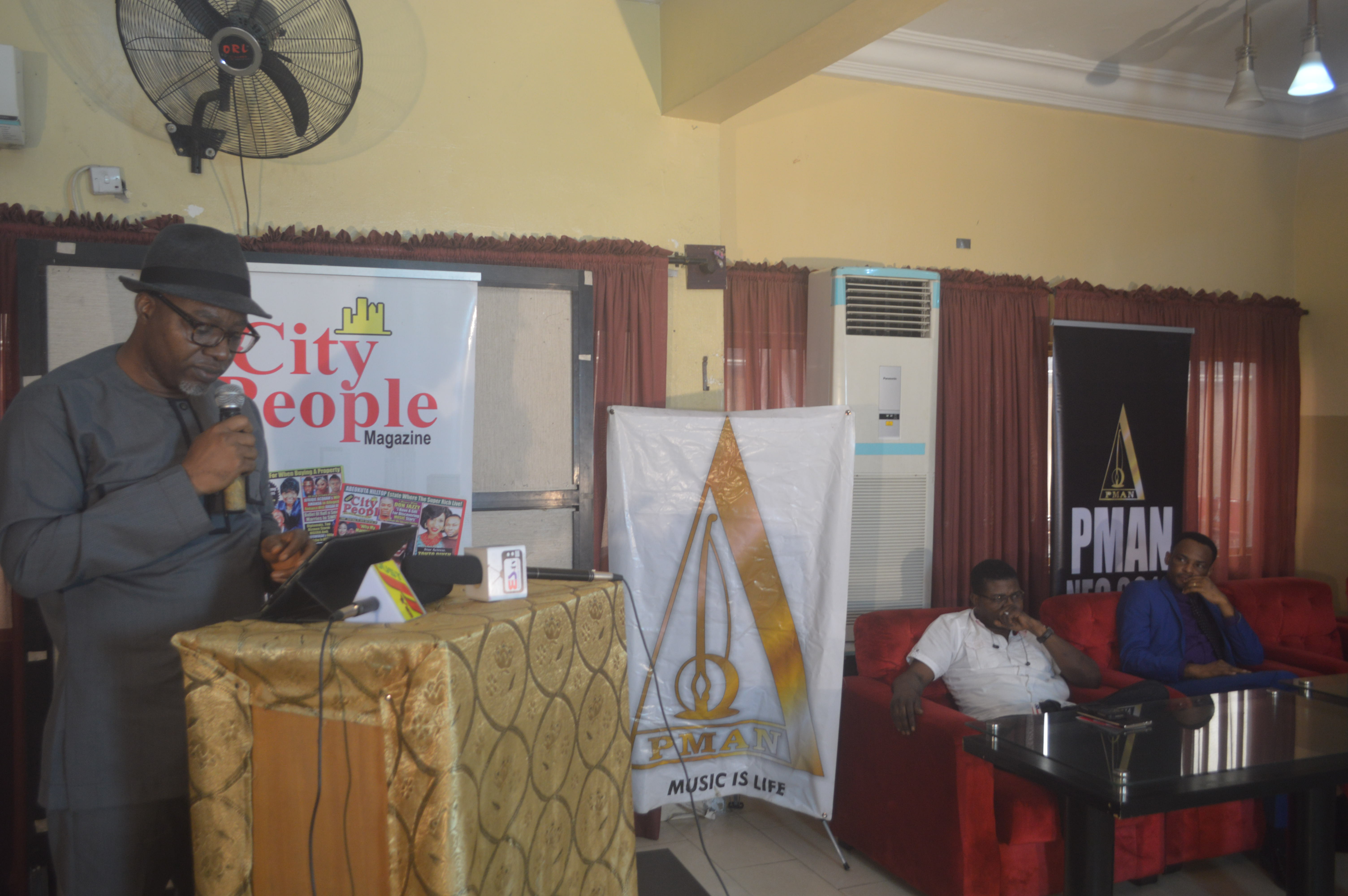 sunny-neji-giving-his-address-at-the-citypeople-pman-awarenes-seminar-while-pman-interim-president-and-exco-members-look-on