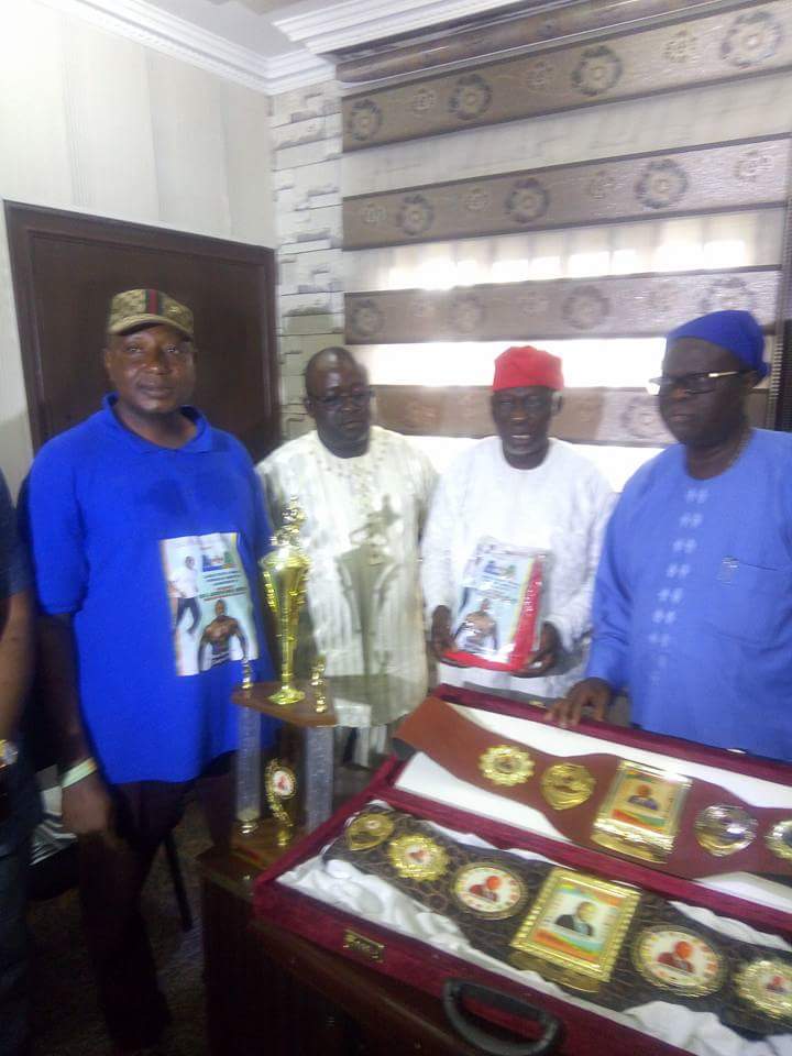 Chairman of the LOC, Otunba Dengel Anifowoshe (middle)  presenting souvenirs to the Deputy Chairman of Lagos APC, Cardinal James Omolaja Odunmbaku (right), while Coordinator of Intercontinental Wrestle Force Championship, Prince Hammed Olanrewaju Mohammed (left)  looks on when the LOC paid Cardinal Odunmbaku a courtesy visit in his office at APC Secretariat on Acme Road, Ikeja recently. 